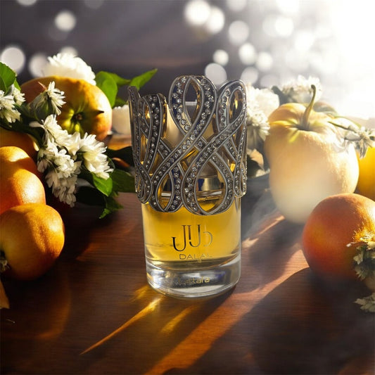Dalal by Lattafa 100ml - fragrance bottle surrounded by fresh citrus fruits and white flowers